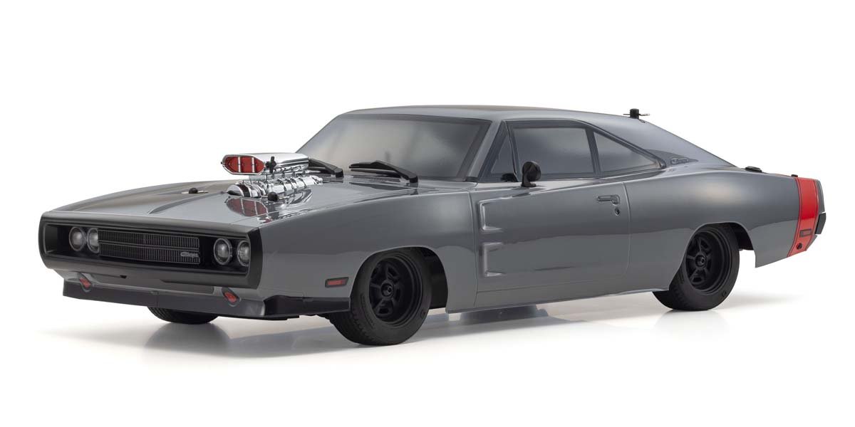 Defining the era of American muscle, the unique characteristics of the ever-popular Dodge Charger have been recreated with concealed headlights equipped with open/close function (operated by optional micro servo on 3rd channel) and the Kyosho designed supercharger. The coke-bottle lines of the semi-fastback 2-door hardtop is immaculately reproduced in a 1/10 scale polycarbonate body.