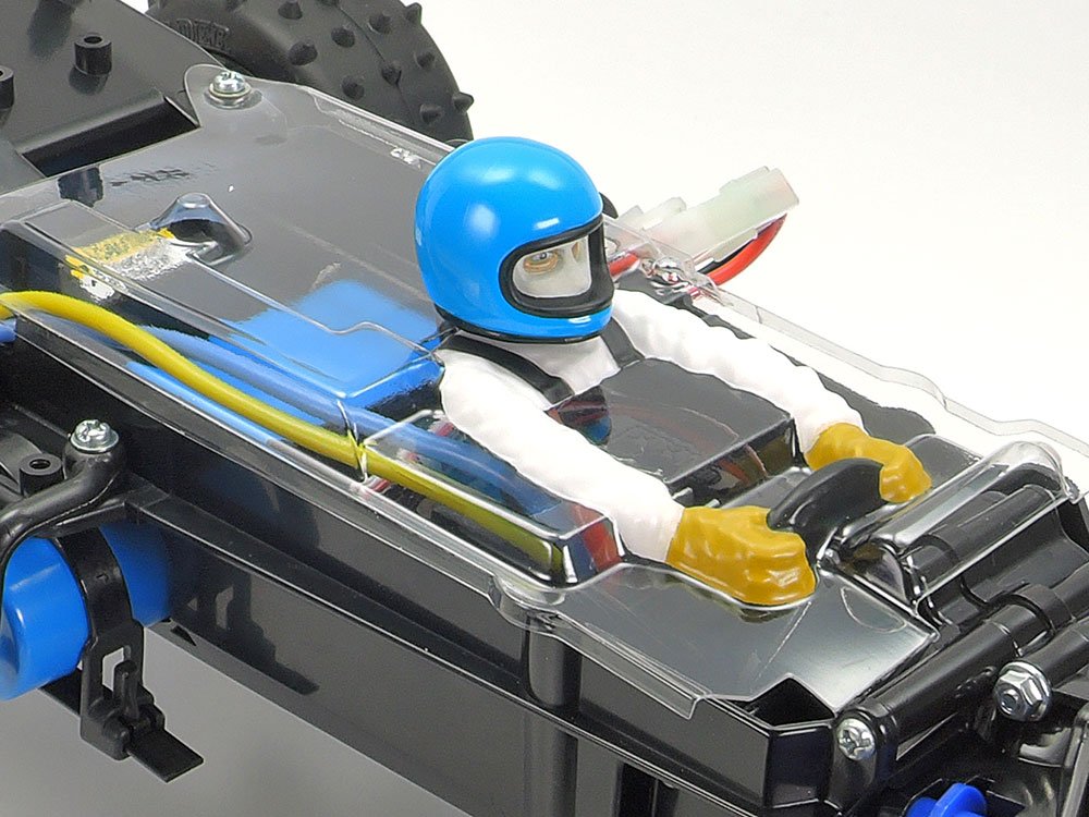 A polycarbonate chassis cover provides protection from dirt, and features a driver figure for realism.