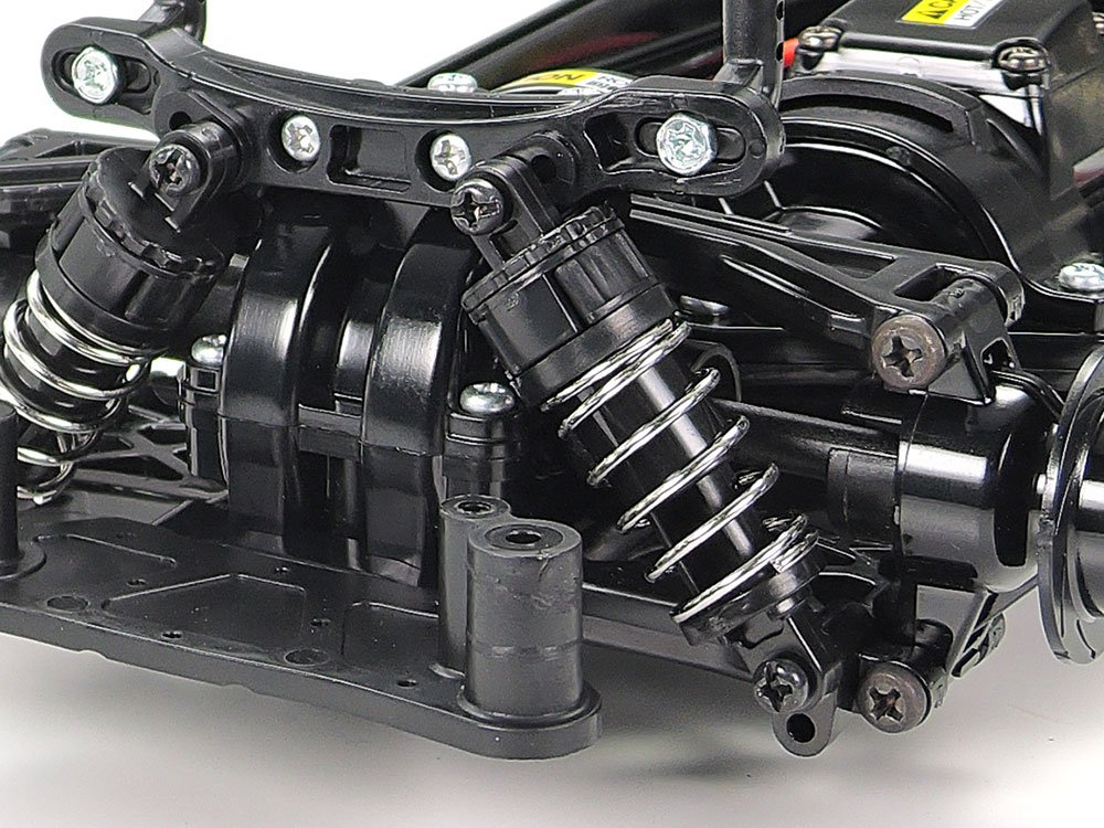 This image gives a closer look at the rear double-wishbone suspension with friction dampers.