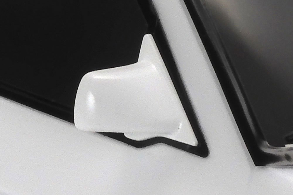 Dedicated, separately injection molded parts are used to recreate the Escort's side mirrors.
