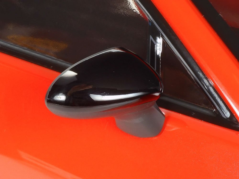 Side mirrors use two types of black (bottom: semi-gloss); mirror surfaces are also cut out of polycarbonate.