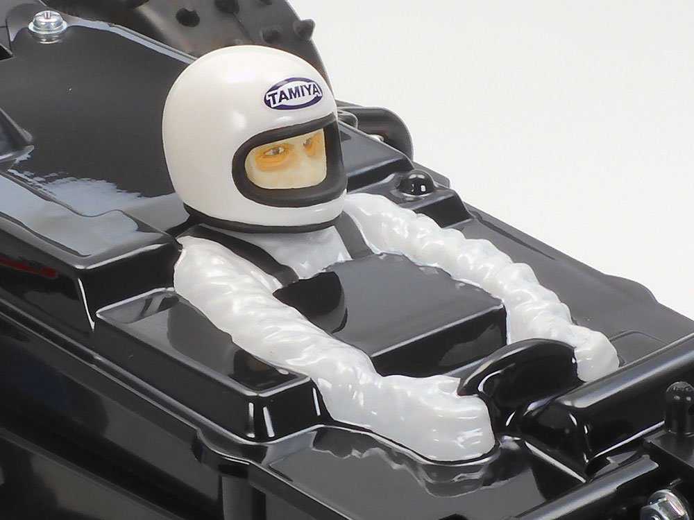 A polycarbonate cover helps minimise debris getting into the chassis, and even features a driver figure!